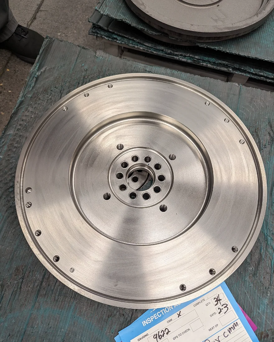 Machined disc part tagged for CMM first article inspection